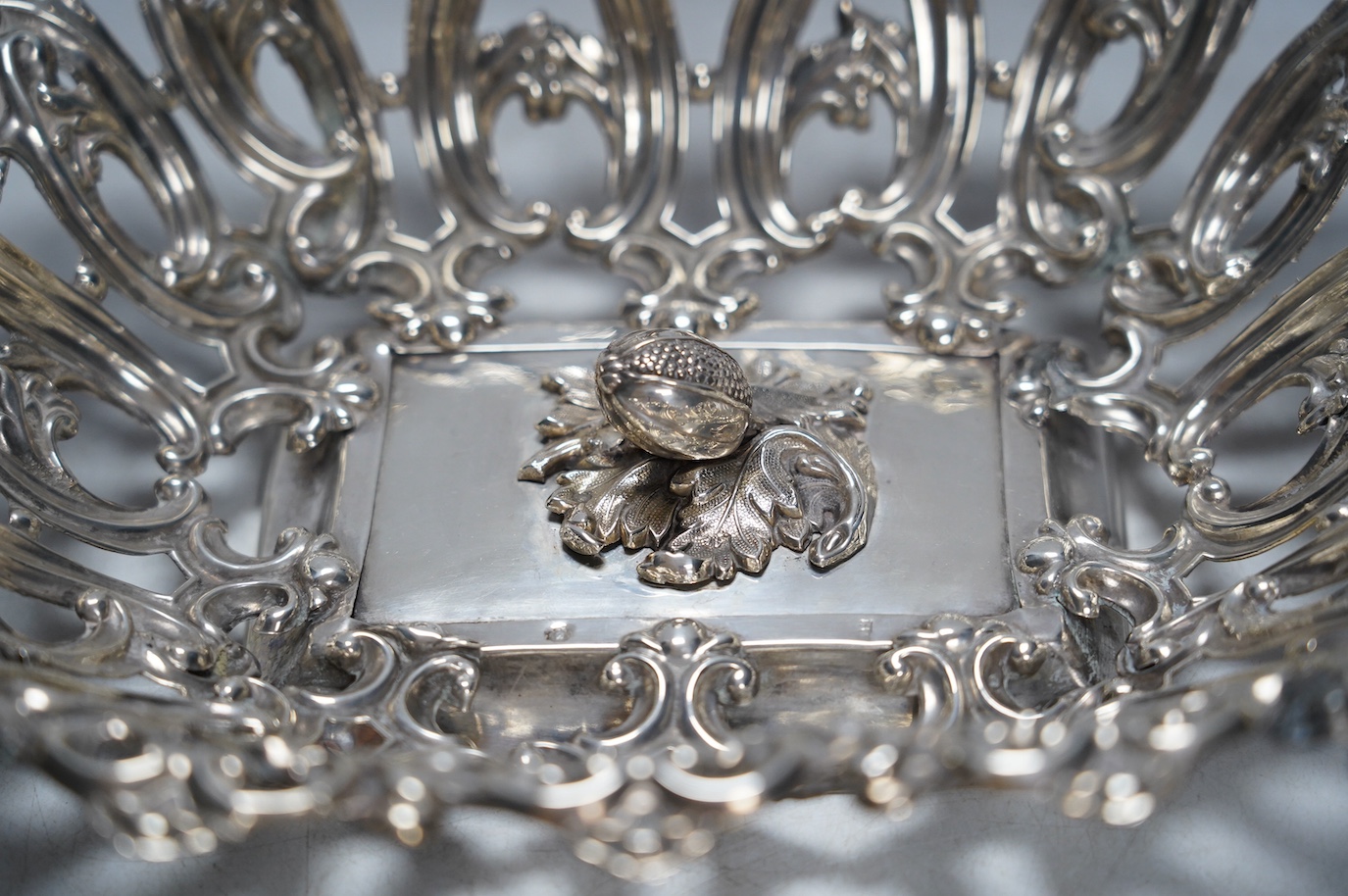 A late 19th/early 20th century Austro-Hungarian pierced 800 white metal fruit bowl, with unusual raised acorn base, 38.4cm, 12.2oz. Condition - poor (repair)